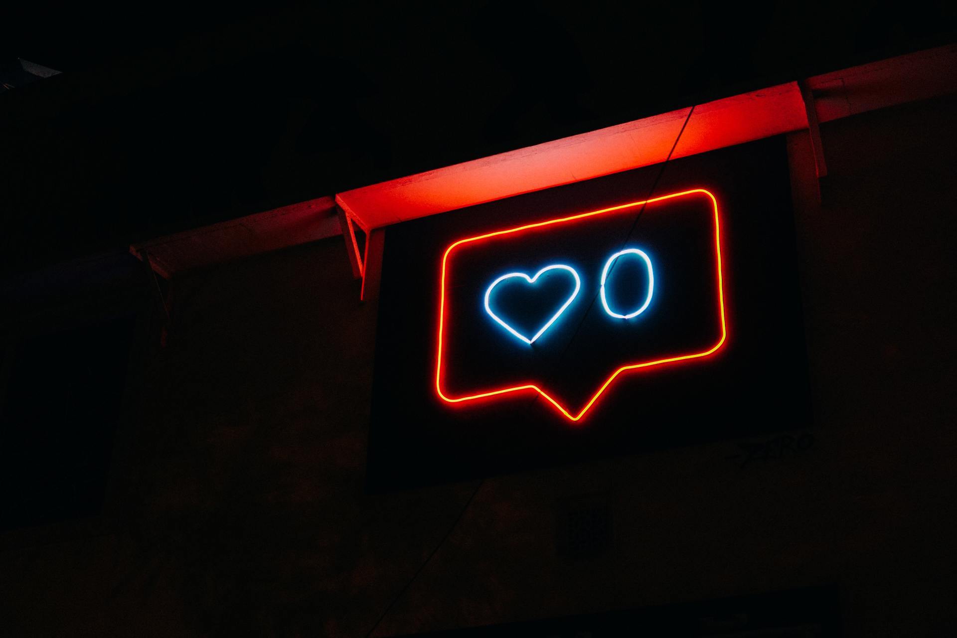 A neon sign showing 'likes'.