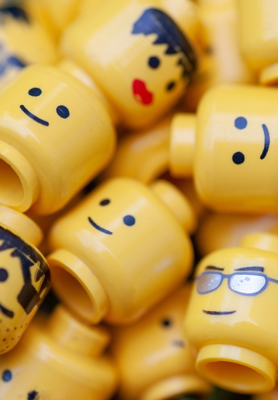 Lots of Lego heads in a pile