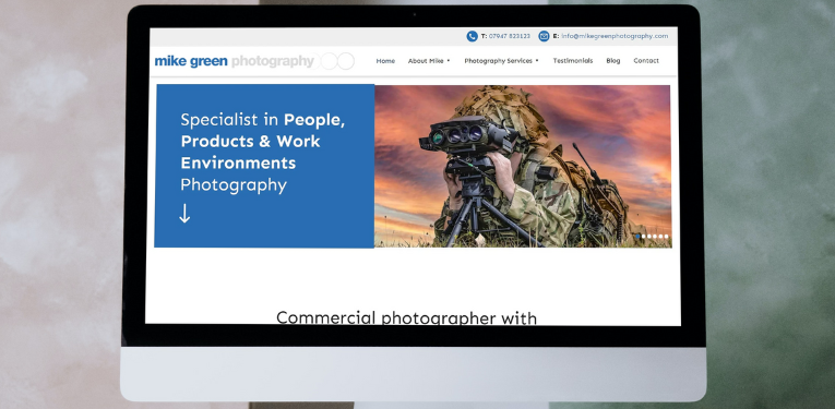 A photography website design shown on a desktop computer
