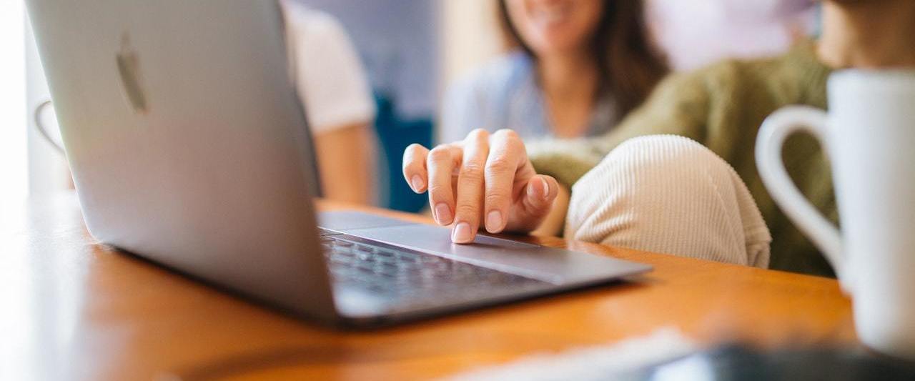 Women editing on a laptop